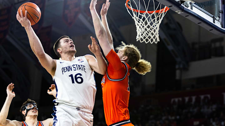 Penn State basketball's Tibor Mirtic (16) attempts a hook shot against Illinois' Jake Davis (15) in The Palestra on Jan. 3, 2026.