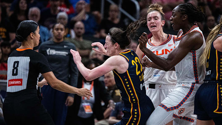 Jun 17, 2025; Indianapolis, Indiana, USA; Connecticut Sun guard Marina Mabrey (3) fouls Indiana Fever guard Caitlin Clark (22)  in the second half at Gainbridge Fieldhouse. Mandatory Credit: Trevor Ruszkowski-Imagn Images
