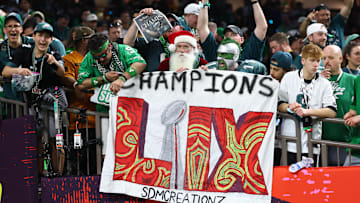 Feb 9, 2025; New Orleans, LA, USA; Philadelphia Eagles fans celebrate in the stands after Super Bowl LIX against the Kansas City Chiefs at Ceasars Superdome. Mandatory Credit: Mark J. Rebilas-Imagn Images
