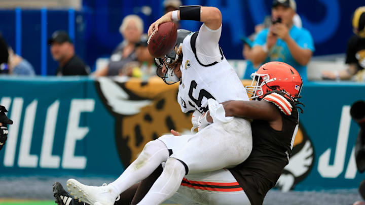 Cleveland Browns defensive end Alex Wright (91) sacks Jacksonville Jaguars quarterback Trevor Lawrence (16) in the end zone for a safety during the fourth quarter of an NFL football matchup Sunday, Sept. 15, 2024 at EverBank Stadium in Jacksonville, Fla. The Browns defeated the Jaguars 18-13. [Corey Perrine/Florida Times-Union]