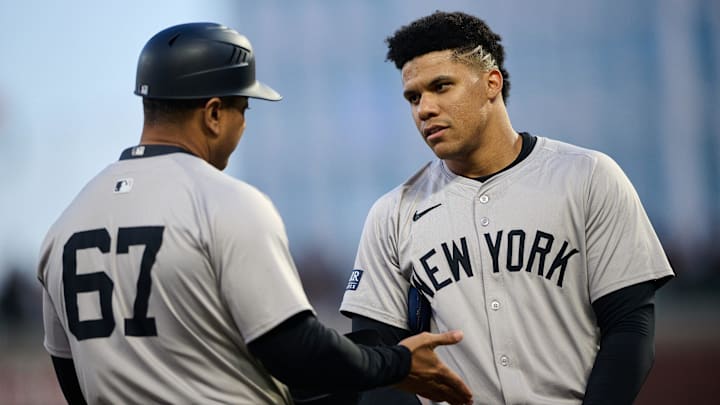 Jun 1, 2024; San Francisco, California, USA; New York Yankees outfielder Juan Soto (22) (right) talks with third base coach Luis Rojas (67) after the last out of the fifth inning against the San Francisco Giants at Oracle Park. Mandatory Credit: Robert Edwards-Imagn Images