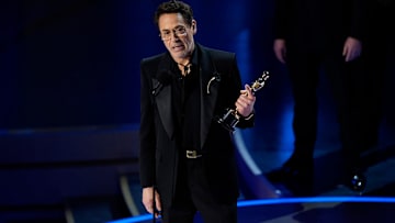 Robert Downey Jr. accepts the award for best actor in a supporting role for his role in \"Oppenheimer\" at the 2024 Oscars.