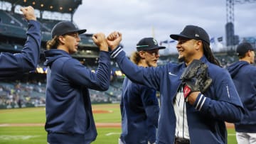 Apr 2, 2024; Seattle, Washington, USA; Seattle Mariners starting pitcher Luis Castillo (58, right) bumps fists with starting pitcher Logan Gilbert (36) before a game against the Cleveland Guardians at T-Mobile Park. Mandatory Credit: Joe Nicholson-USA TODAY Sports