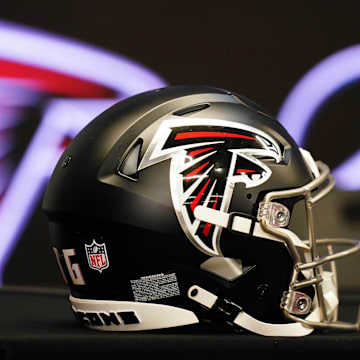 Feb 5, 2024; Atlanta, GA, USA; Atlanta Falcons helmet on the table before Raheem Morris is introduced as the new head coach of the Atlanta Falcons at Mercedes-Benz Stadium. Mandatory Credit: John David Mercer-Imagn Images