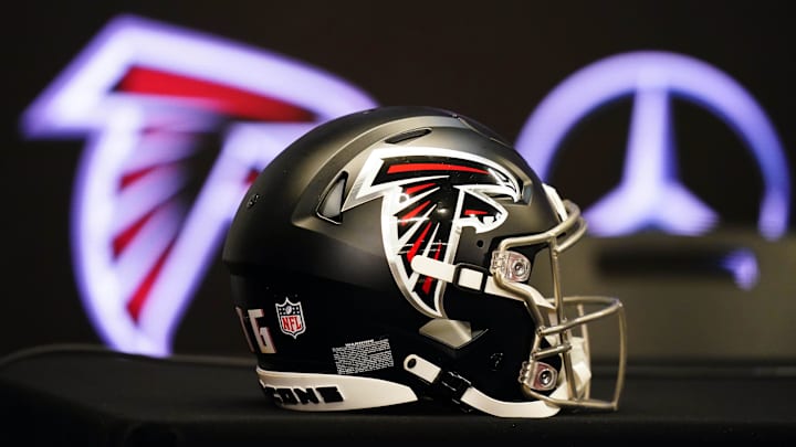 Feb 5, 2024; Atlanta, GA, USA; Atlanta Falcons helmet on the table before Raheem Morris is introduced as the new head coach of the Atlanta Falcons at Mercedes-Benz Stadium. Mandatory Credit: John David Mercer-Imagn Images