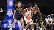 Mar 12, 2025; Charlotte, NC, USA; Stanford Cardinal forward Chisom Okpara (10) handles the ball against California Golden Bears guard Andrej Stojakovic (2) during the first half at Spectrum Center. Mandatory Credit: Jim Dedmon-Imagn Images