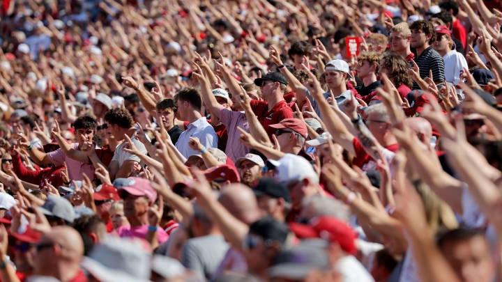 Oklahoma fans stand before a college football game between the University of Oklahoma Sooners (OU) and the Arkansas State Red Wolves at Gaylord Family-Oklahoma Memorial Stadium in Norman, Okla., Saturday, Sept. 2, 2023. Oklahoma won 73-0.