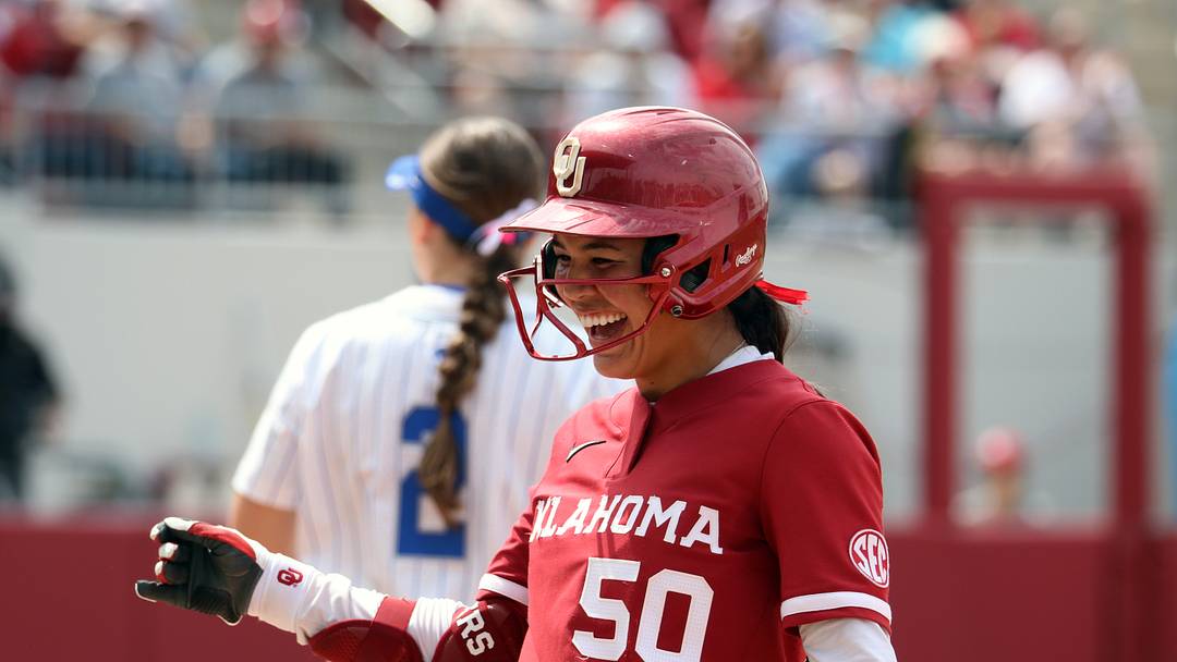 Oklahoma second baseman Ailana Agbayani smiles after reaching on a hit against Kentucky at Love's Field.