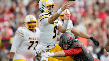 Missouri Tigers quarterback Beau Pribula (9) looks to make a pass, in a game versus the Oklahoma Sooners this season.