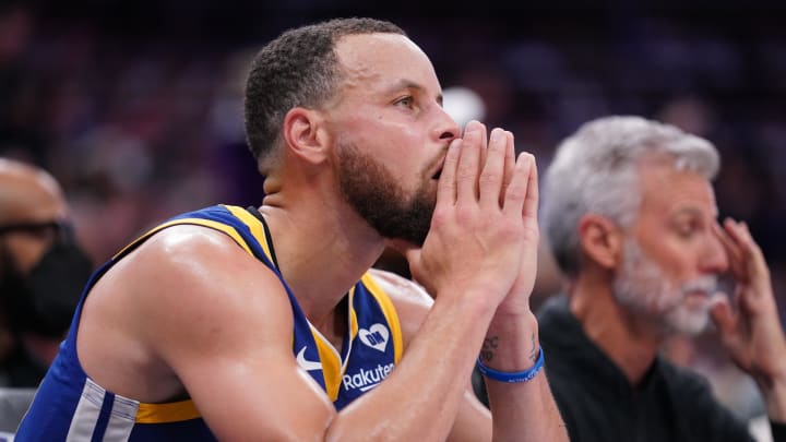 Apr 16, 2024; Sacramento, California, USA; Golden State Warriors guard Stephen Curry (30) sits on the bench during action against the Sacramento Kings in the fourth quarter during a play-in game of the 2024 NBA playoffs at the Golden 1 Center. Mandatory Credit: Cary Edmondson-USA TODAY Sports