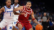 Arkansas Razorbacks guard Darius Acuff Jr. (5) handles the ball against Memphis Tigers guard Dug McDaniel (1) during the second half at FedEx Forum.