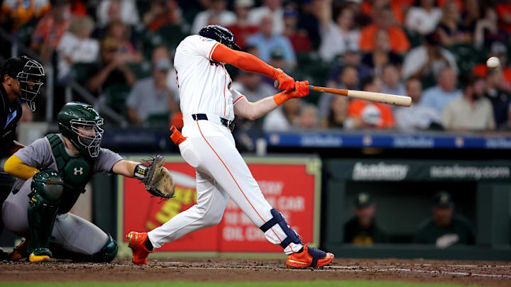 Sep 12, 2024; Houston, Texas, USA; Houston Astros designated hitter Kyle Tucker (30) hits a double to right field against the Oakland Athletics during the third inning at Minute Maid Park