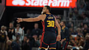 Mar 15, 2025; San Francisco, California, USA; Golden State Warriors guard Stephen Curry (30) celebrates his four thousand and one three point basket against the New York Knicks during the first quarter at Chase Center. Mandatory Credit: Neville E. Guard-Imagn Images