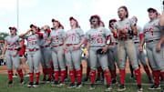 Nebraska players celebrate after winning the Baton Rouge Regional.