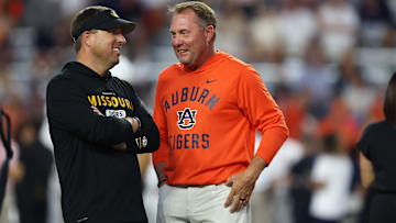 Oct 18, 2025; Auburn, Alabama, USA; Missouri Tigers head coach Eli Drinkwitz and Auburn Tigers head coach Hugh Freeze speak before the game at Jordan-Hare Stadium. Mandatory Credit: John Reed-Imagn Images