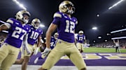 Washington Huskies wide receiver Denzel Boston celebrates after returning a punt for a touchdown.