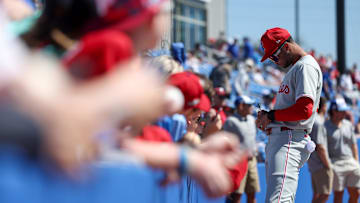 Mar 2, 2025; Dunedin, Florida, USA; Philadelphia Phillies outfielder Justin Crawford (80) signs autographs for fans before a game against the Toronto Blue Jays during spring training at TD Ballpark. 