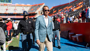 Nov 23, 2024; Gainesville, Florida, USA; Mississippi Rebels head coach Lane Kiffin walks off the field before a game against the Florida Gators at Ben Hill Griffin Stadium. Mandatory Credit: Matt Pendleton-Imagn Images