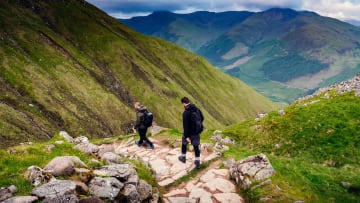 Two hikers descending Ben Nevis, Scotland's tallest mountain.