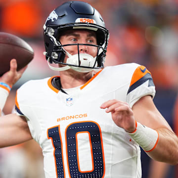 Aug 18, 2024; Denver, Colorado, USA; Denver Broncos quarterback Bo Nix warms up in the first quarter against the Green Bay Packers at Empower Field at Mile High. 