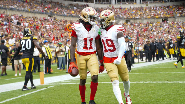 Sep 10, 2023; Pittsburgh, Pennsylvania, USA; San Francisco 49ers wide receiver Deebo Samuel (19) congratulates San Francisco 49ers wide receiver Brandon Aiyuk (11) for catching a touchdown pass against the Pittsburgh Steelers during the first half at Acrisure Stadium. Mandatory Credit: Gregory Fisher-USA TODAY Sports