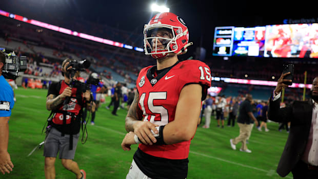 Georgia Bulldogs quarterback Carson Beck (15) walks off the field after the game of an NCAA college football matchup Saturday