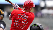 Sep 21, 2025; Denver, Colorado, USA; Los Angeles Angels designated hitter Mike Trout (27) double in the first inning against the Colorado Rockies at Coors Field. Mandatory Credit: Ron Chenoy-Imagn Images