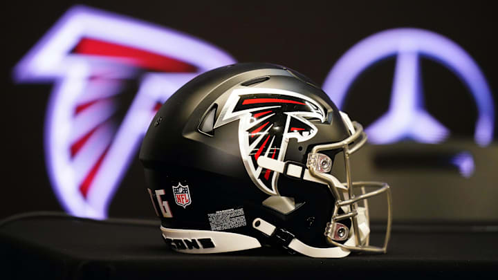 Feb 5, 2024; Atlanta, GA, USA; Atlanta Falcons helmet on the table before Raheem Morris is introduced as the new head coach of the Atlanta Falcons at Mercedes-Benz Stadium. Mandatory Credit: John David Mercer-Imagn Images
