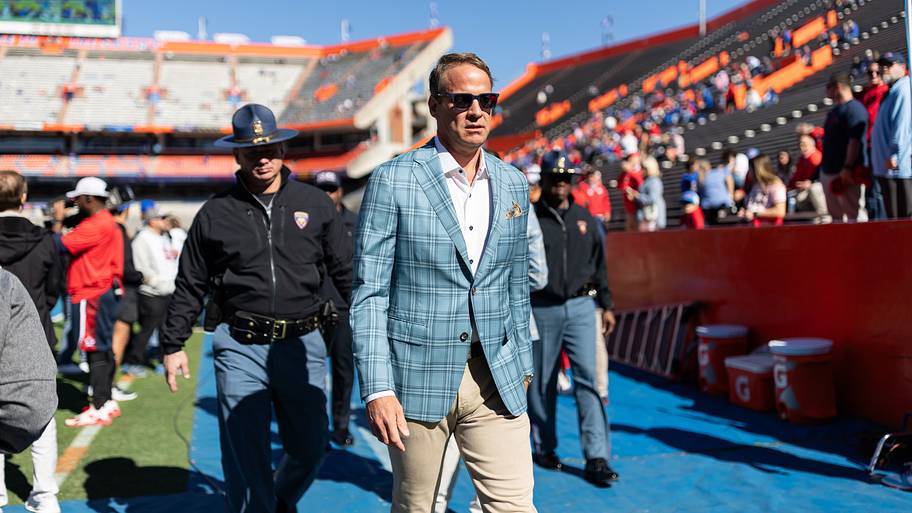 Mississippi Rebels head coach Lane Kiffin walks off the field before a game against the Florida Gators.