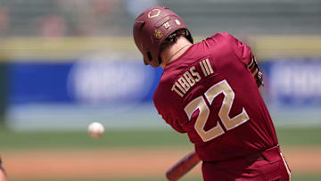 May 25, 2024; Charlotte, NC, USA; Florida State outfielder James Tibbs III (22) hits a ball in the second inning against Wake Forest during the ACC Baseball Tournament at Truist Field. Mandatory Credit: Cory Knowlton-Imagn Images