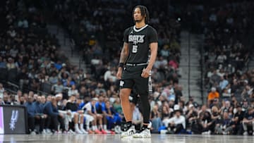 Apr 1, 2025; San Antonio, Texas, USA;  San Antonio Spurs guard Stephon Castle (5) looks on in the first half against the Orlando Magic at Frost Bank Center. Mandatory Credit: Daniel Dunn-Imagn Images