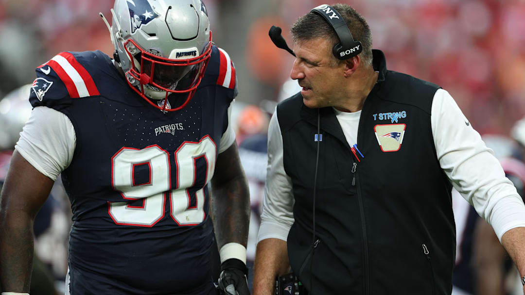 Nov 9, 2025; Tampa, Florida, USA; New England Patriots defensive tackle Christian Barmore (90) talks with head coach Mike Vrabel during the third quarter against the Tampa Bay Buccaneers at Raymond James Stadium.