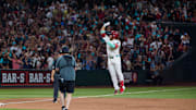 Phoenix, Arizona, USA; Arizona Diamondbacks infielder Eugenio Suarez (28) reacts after hitting his fourth home run of the game against the Atlanta Braves during the ninth inning at Chase Field.