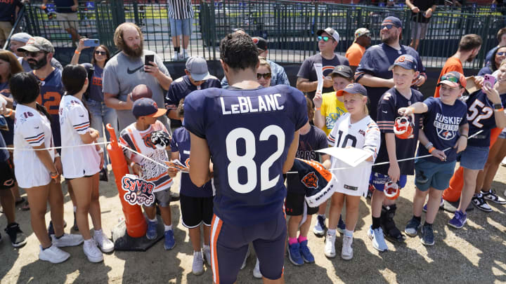 Former Bears receiver Peter LeBlanc, signing autographs here at camp, is a Bears receiver once again.