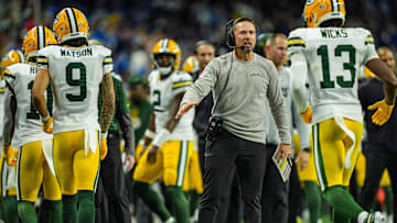 Green Bay Packers head coach Matt LaFleur slaps hands with players after the offense scores a touchdown against the Detroit Lions, during the Thursday Night Football at Ford Field in Detroit on Thursday, Dec. 5, 2024.
