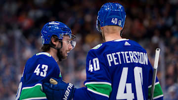 May 16, 2024; Vancouver, British Columbia, CAN; Vancouver Canucks defenseman Quinn Hughes (43) and forward Elias Pettersson (40) talk during a stop in play against the Edmonton Oilers during the third period in game five of the second round of the 2024 Stanley Cup Playoffs at Rogers Arena. Mandatory Credit: Bob Frid-Imagn Images