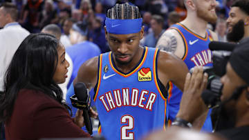 Oct 21, 2025; Oklahoma City, Oklahoma, USA; Oklahoma City Thunder guard Shai Gilgeous-Alexander (2) is interviewed by media at the end of a double overtime win against the Houston Rockets at Paycom Center. Mandatory Credit: Alonzo Adams-Imagn Images