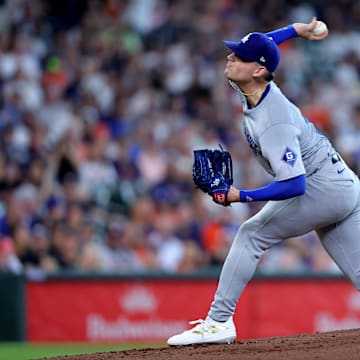 Jul 28, 2024; Houston, Texas, USA; Los Angeles Dodgers pitcher River Ryan (77) delivers a pitch against the Houston Astros during the first inning at Minute Maid Park. Mandatory Credit: Erik Williams-Imagn Images