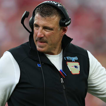 Nov 9, 2025; Tampa, Florida, USA; New England Patriots head coach Mike Vrabel walks downfield during the third quarter against the Tampa Bay Buccaneers at Raymond James Stadium. Mandatory Credit: Nathan Ray Seebeck-Imagn Images