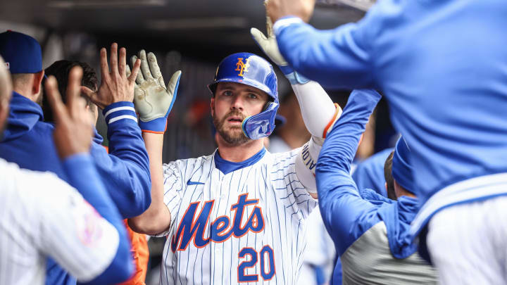 New York Mets first baseman Pete Alonso is greeted by teammates after hitting his third home run of the weekend against the Kansas City Royals