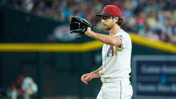 Apr 13, 2025; Phoenix, Arizona, USA;  Arizona Diamondbacks pitcher Zac Gallen (23) calls for the ball while on the mound in the fourth inning against the Milwaukee Brewers at Chase Field. Mandatory Credit: Allan Henry-Imagn Images