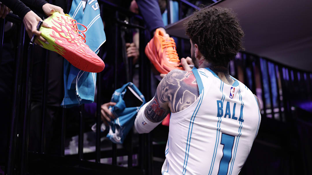 Mar 11, 2026; Sacramento, California, USA; Charlotte Hornets guard LaMelo Ball (1) autographs shoes in the tunnel after the game against the Sacramento Kings at Golden 1 Center. Mandatory Credit: Kelley L Cox-Imagn Images