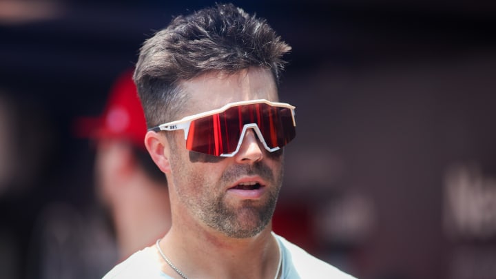 Jul 7, 2024; Atlanta, Georgia, USA; Philadelphia Phillies left fielder Whit Merrifield (9) in the dugout against the Atlanta Braves in the first inning at Truist Park