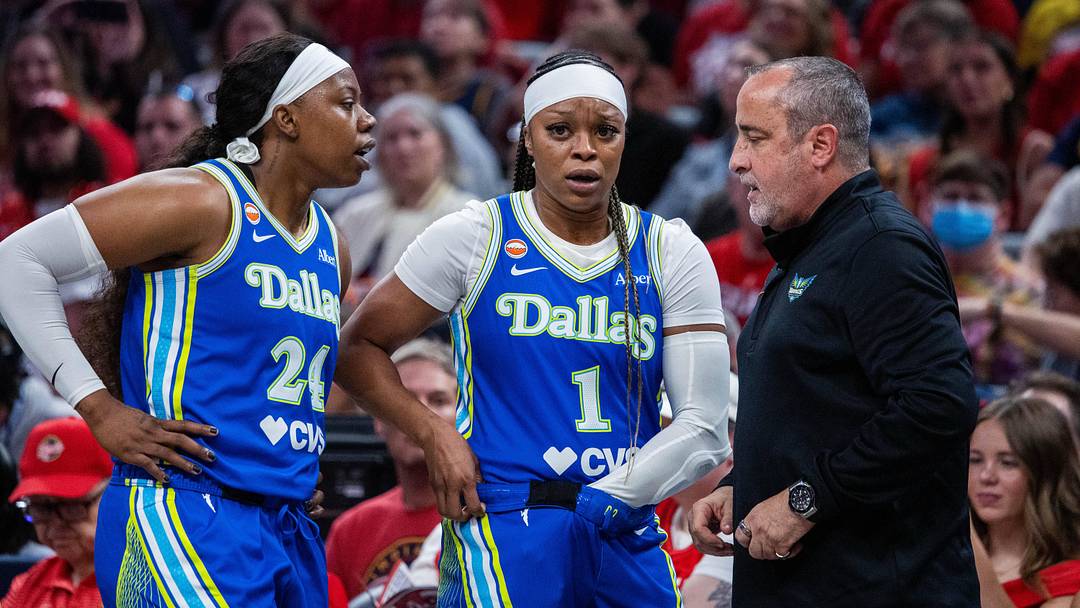 May 9, 2026; Indianapolis, Indiana, USA; Dallas Wings guard Arike Ogunbowale (24) and guard Odyssey Sims (1) talk with head coach Jose Fernandez in the second half against the Indiana Fever at Gainbridge Fieldhouse. Mandatory Credit: Trevor Ruszkowski-Imagn Images