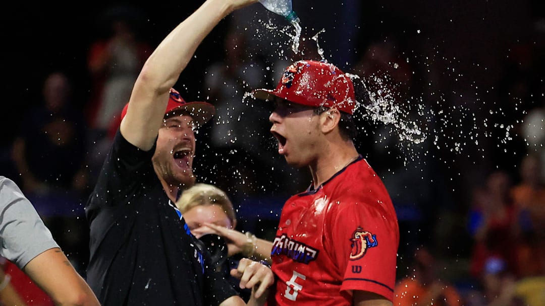Jacksonville Jumbo Shrimp pitcher Adam Mazur (1), douses pitcher Josh White (6) with water after the game of Game 3 of an MiLB International League Championship Series at VyStar Ballpark Thursday, Sept. 25, 2025 in Jacksonville, Fla. The Jacksonville Jumbo Shrimp defeated the Scranton/Wilkes-Barre RailRiders 7-4 and took home the title in a best-of-three game series