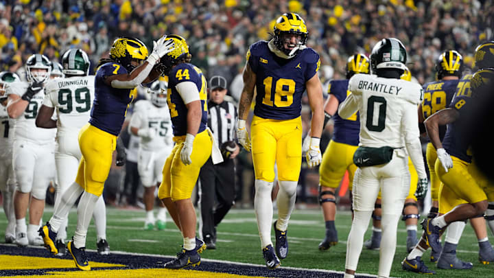 Michigan tight end Colston Loveland (18) celebrates scoring a touchdown against Michigan State during the second half at Michigan Stadium in Ann Arbor on Saturday, Oct. 26, 2024.
