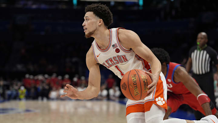Mar 13, 2025; Charlotte, NC, USA;  Clemson Tigers guard Chase Hunter (1) drives to the basket against the Southern Methodist Mustangs during the second half at Spectrum Center. Mandatory Credit: Jim Dedmon-Imagn Images
