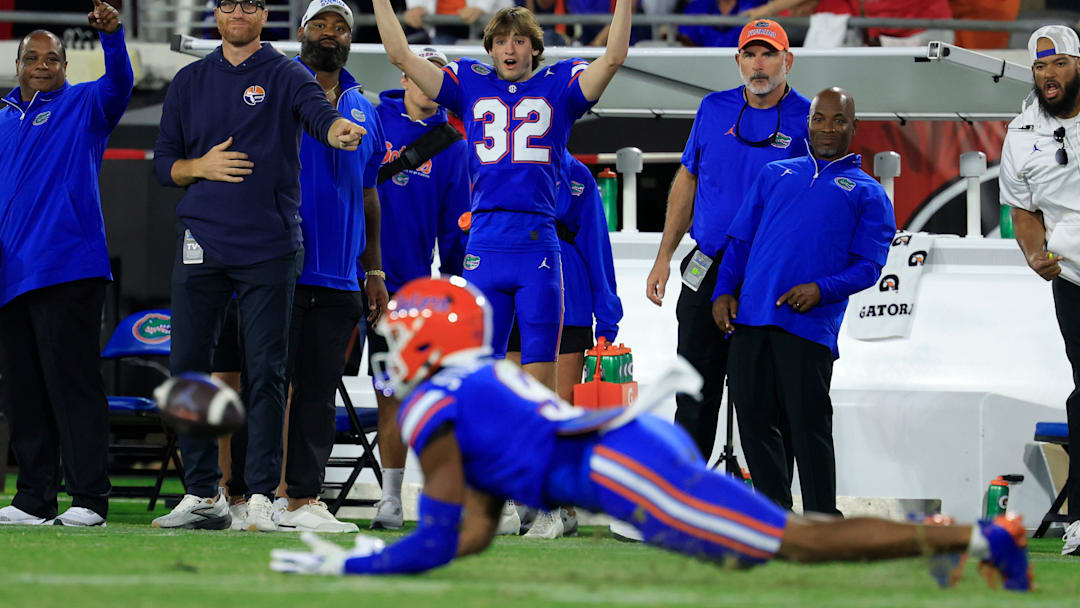 Florida Gators place kicker Evan Noel (32) reacts as wide receiver J. Michael Sturdivant (9) catches the ball but is deemed incomplete, touching the turf, on a critical down during the fourth quarter of an NCAA football game, Saturday, Nov. 1, 2025, at EverBank Stadium in Jacksonville, Fla. Georgia held off Florida 24-20. [Corey Perrine/Florida Times-Union]