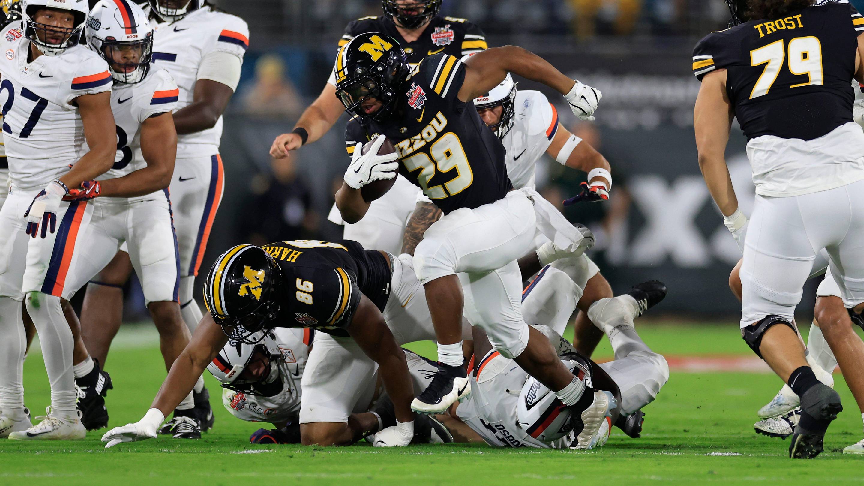 Missouri Tigers running back Ahmad Hardy (29) rushes for yards during the first quarter of the TaxSlayer Gator Bowl