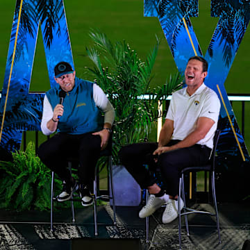 From left, emcee Jaguars senior reporter/editor J.P. Shadrick, Jacksonville Jaguars head coach Liam Coen, and Jacksonville Jaguars Hall of Famer Tony Boselli laugh on stage Thursday, Jan. 30, 2025 at EverBank Stadium in Jacksonville, Fla. Jaguars fans got a chance to see the new head coach speak and give a warm welcome at the stadium.